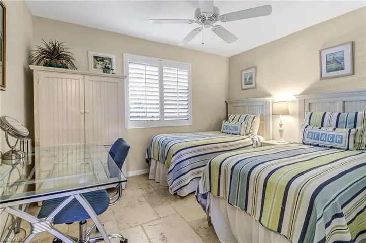 Tiled bedroom with ceiling fan