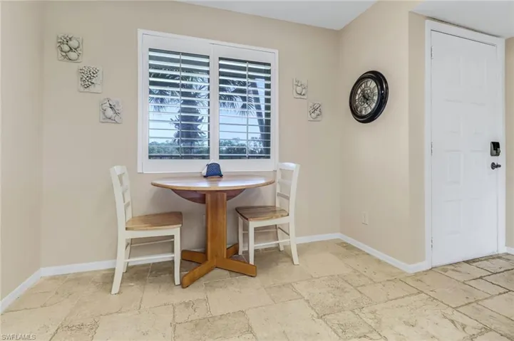 Eat in Kitchen with light tile floors
