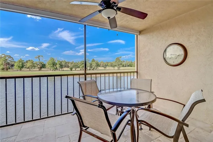 Screened Patio with a water view and ceiling fan