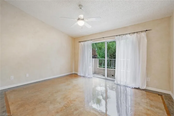 Primary bedroom with balcony