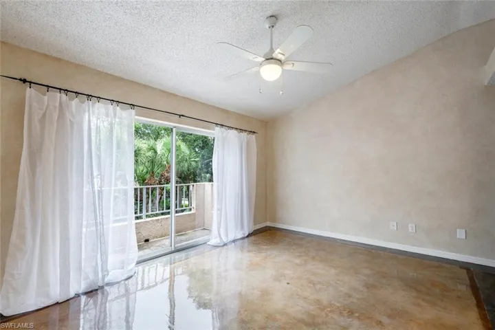 Primary bedroom stained concrete floors