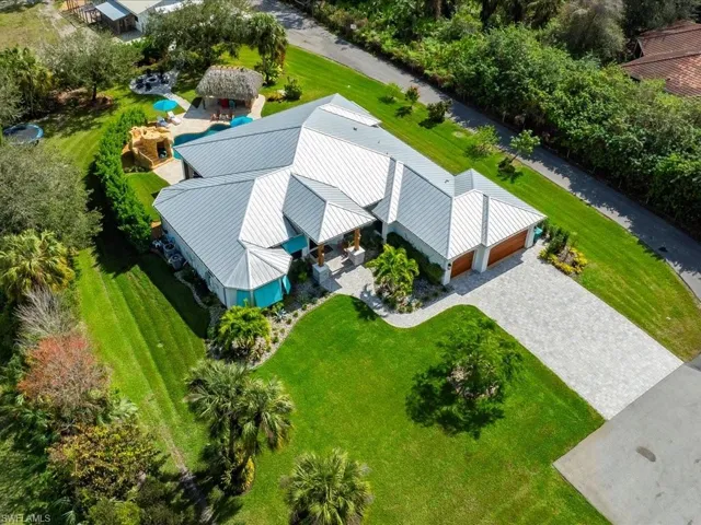 Full sod and irrigation was added around the entire home in 2023. Landscape lighting and tropical privacy landscaping surrounding the property in the last few years. Including a Royal Poinciana in the front, two avocado, one lemon, and one lime tree.