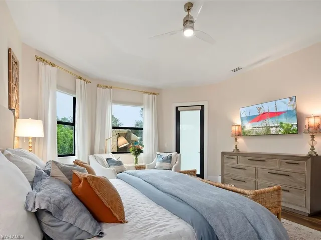 This bedroom is sized generously and easily fits a king sized bedroom suite while still allowing room for a reading nook. It also has direct access to the screened lanai.
