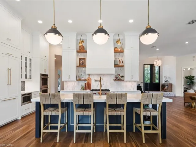 The kitchen was totally reconfigured and transformed into a chef and entertainer's dream! The custom cabinets (throughout the house) were handcrafted by Willow House in Bonita Springs