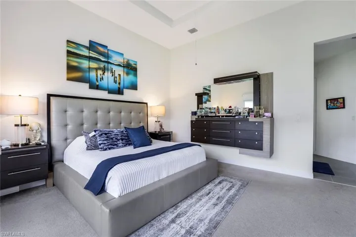 Carpeted bedroom with baseboards