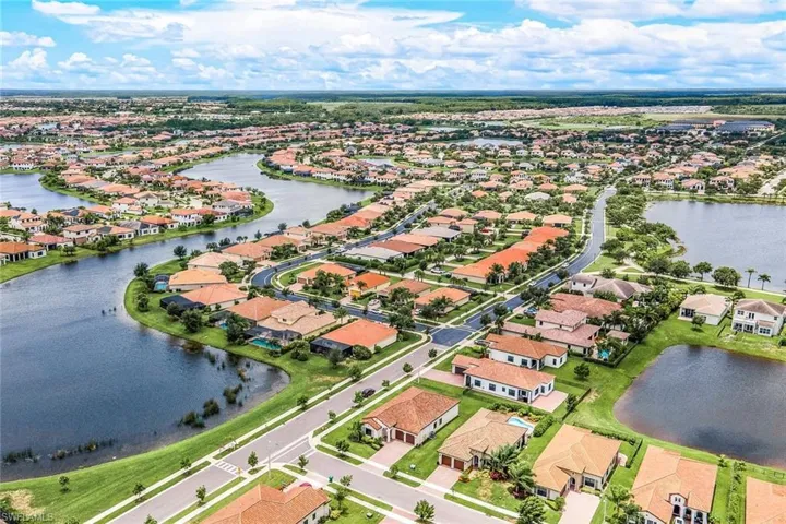 Aerial overview of property's location with a large body of water and nearby suburban area