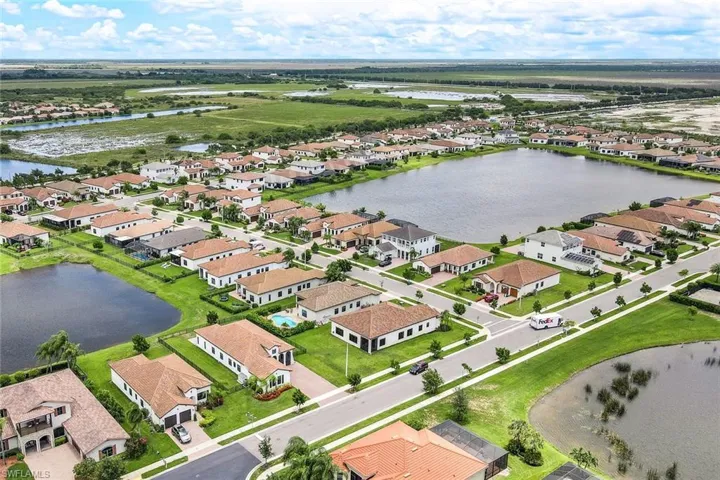 Aerial perspective of suburban area with a large body of water