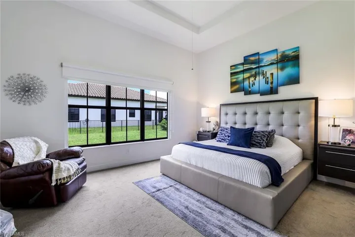 Bedroom with carpet floors and baseboards