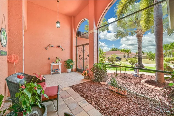 Doorway to property featuring stucco siding