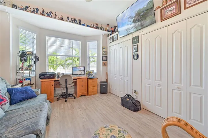 Office area featuring light wood-style floors