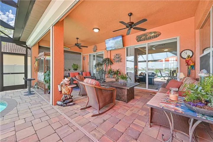 View of patio featuring outdoor dining space and ceiling fan