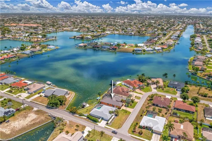 View of property location featuring nearby suburban area and a nearby body of water