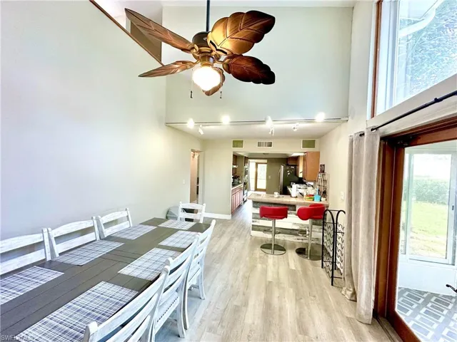Vaulted ceiling with an overhead fan and light fixture