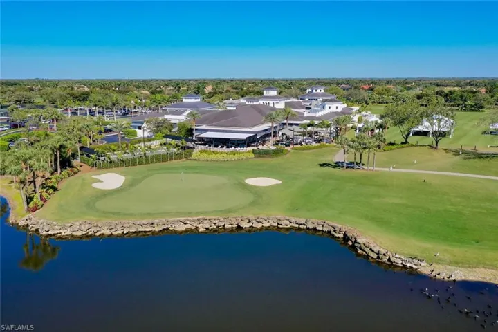 Aerial view with golf course view and clubhouse