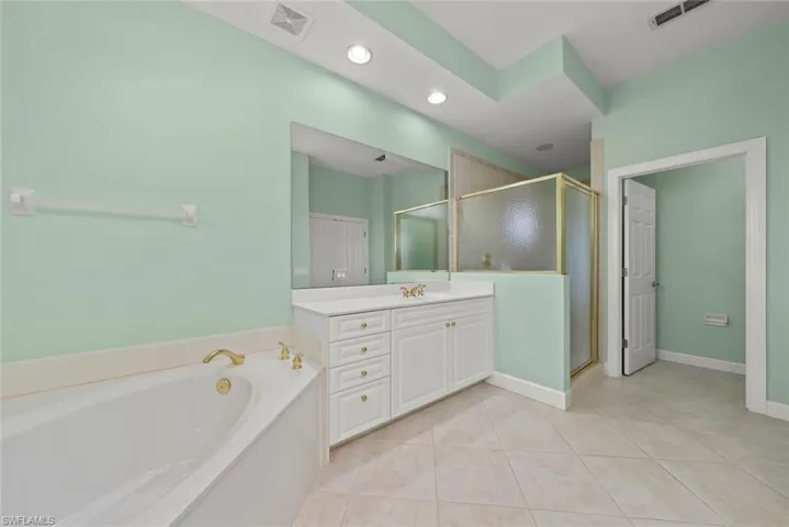 Primary bathroom with separate tub and shower