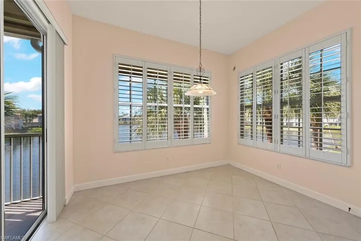 Breakfast dining area with tile floors and views of the water.