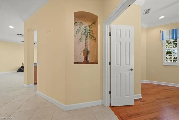 Hallway and entry to den with custom painted palm tree
