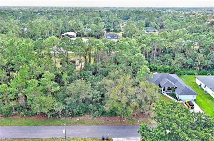 Aerial overview of property's location with a forest