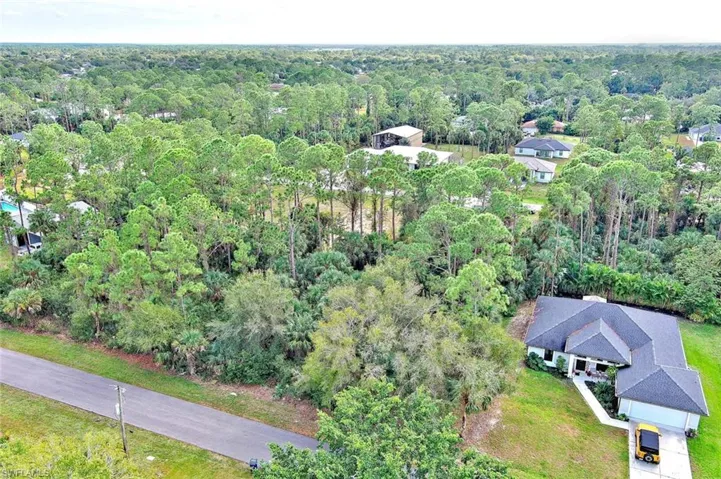View of property location featuring a heavily wooded area