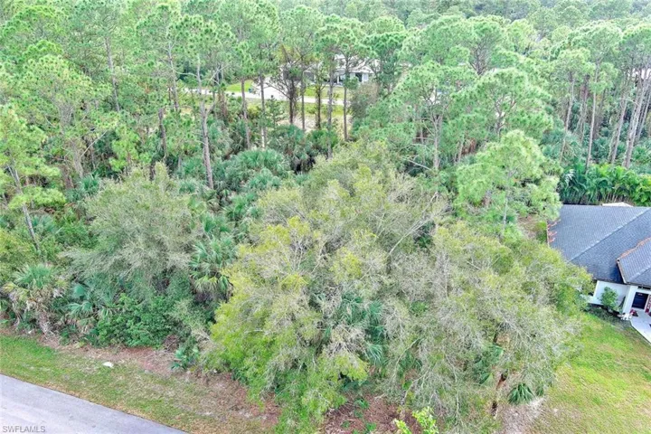 Aerial overview of property's location featuring a forest