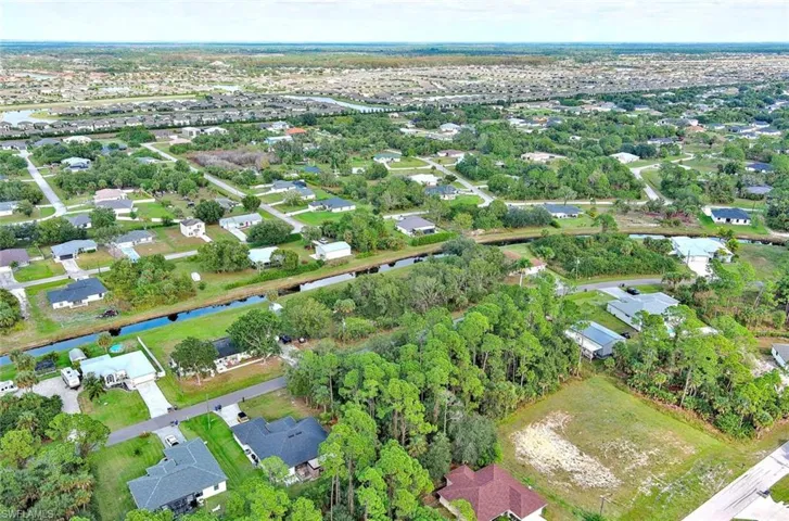 View of property location with nearby suburban area and a large body of water
