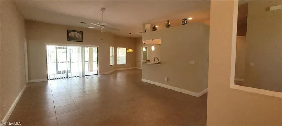 Empty room featuring ceiling fan