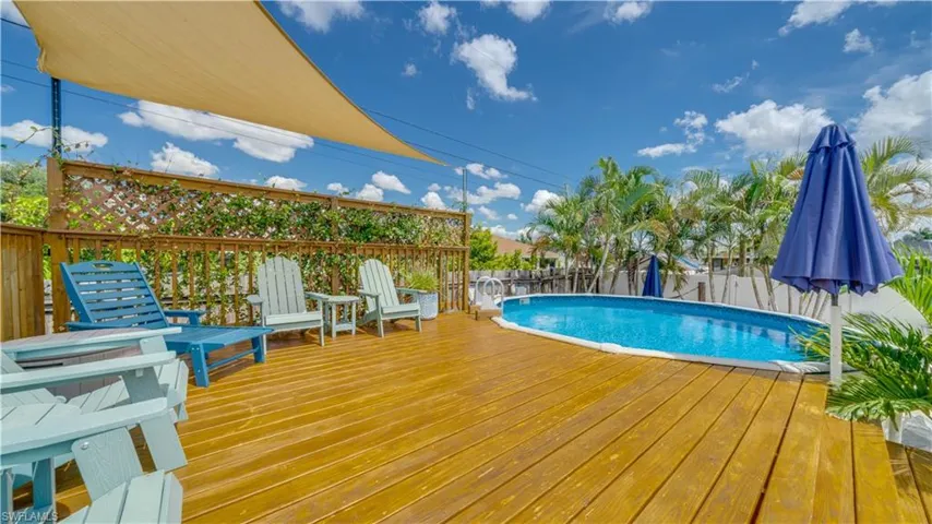 Beautiful wood deck to lounge by the pool.