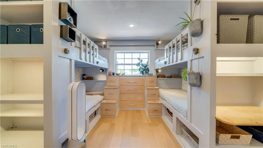2nd guest bedroom with laminate flooring, panel closet and awesome built-in bunk beds which are included with the sale.