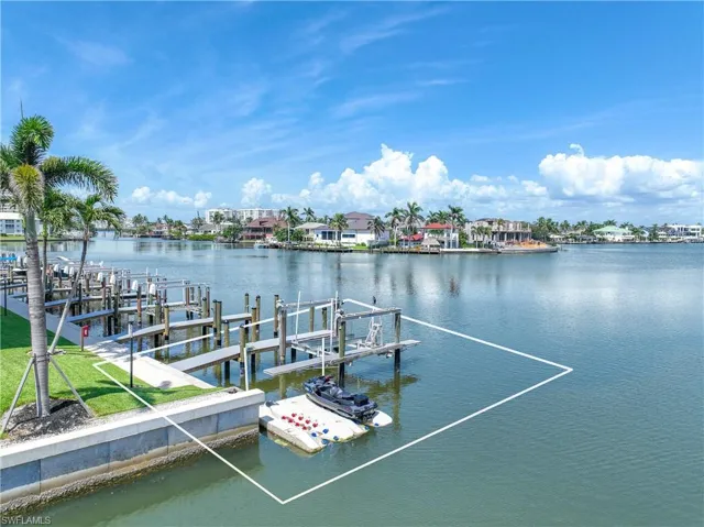 Dock area featuring a water view and boat lift