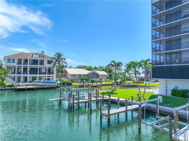 Dock area with boat lift and a water view