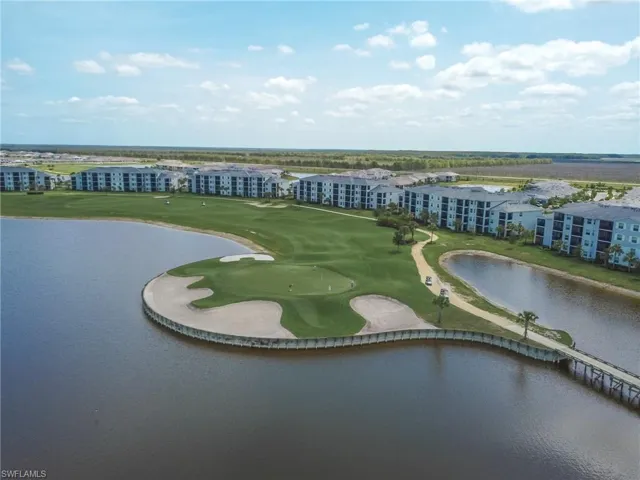 Bird's eye view of a nearby body of water and a golf course