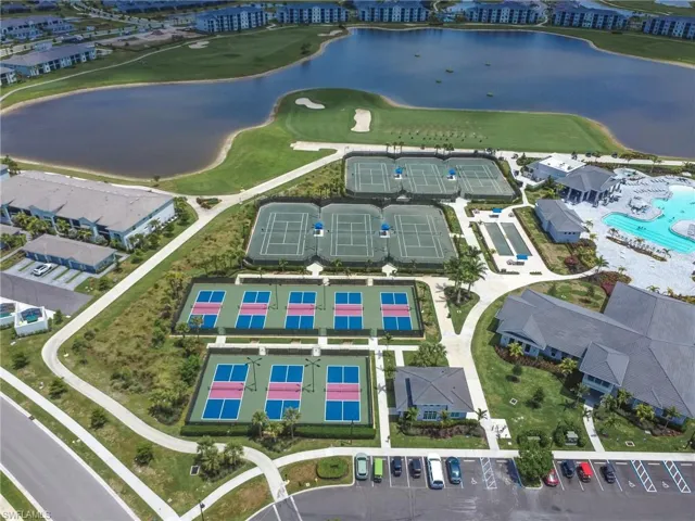 Drone / aerial view of tennis and pickelball courts and large body of water