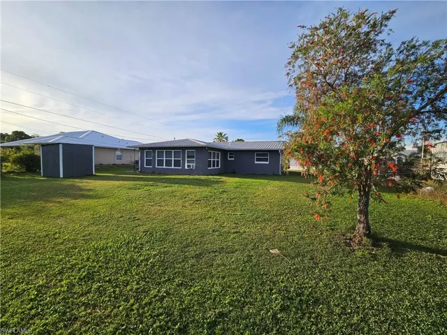 View of yard with a storage unit and an outdoor structure
