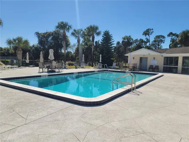 Community pool featuring a patio