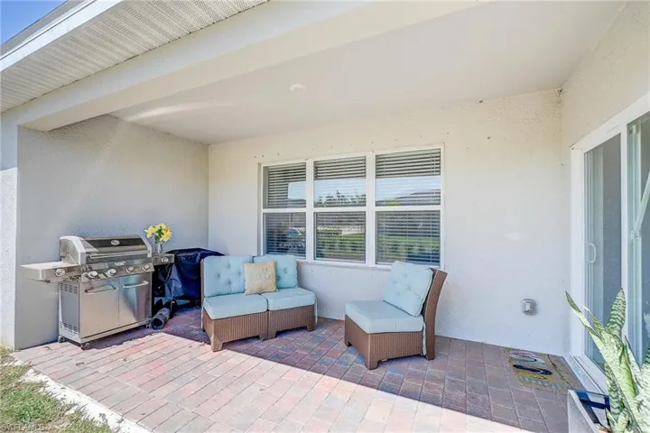 View of patio featuring area for grilling and outdoor lounge area