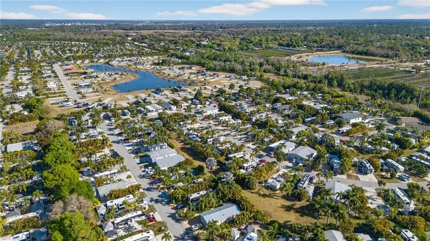 View of property location with nearby suburban area and a nearby body of water