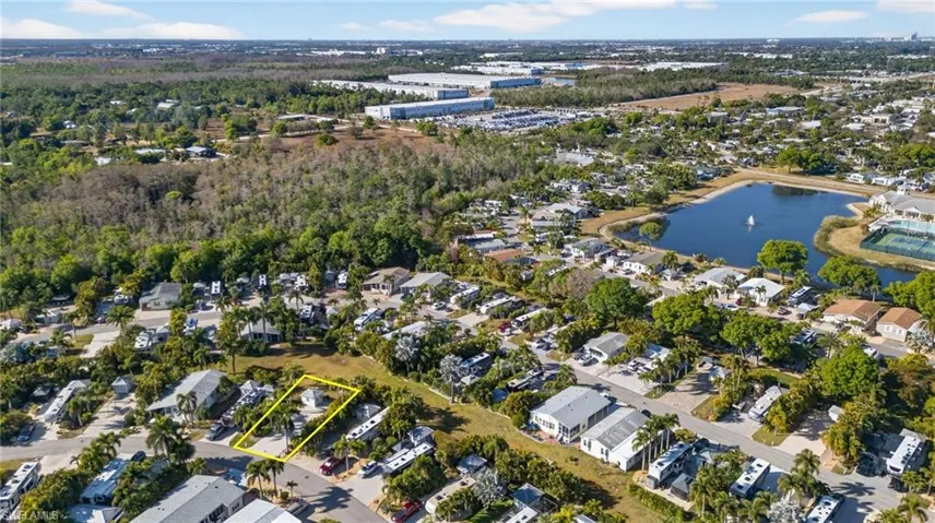 Aerial view of property's location featuring nearby suburban area and property parcel outlined