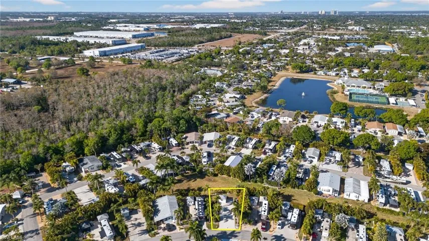 View of property location featuring property boundaries highlighted, nearby suburban area, and a nearby body of water