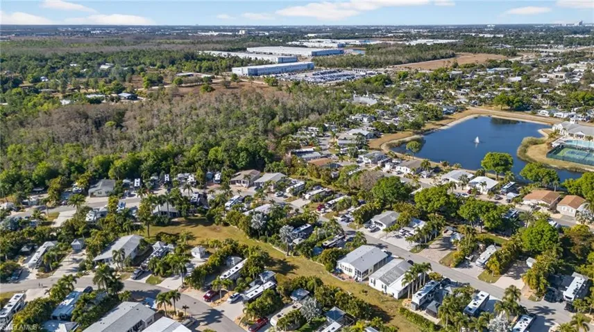 Aerial view of property's location featuring nearby suburban area and a large body of water