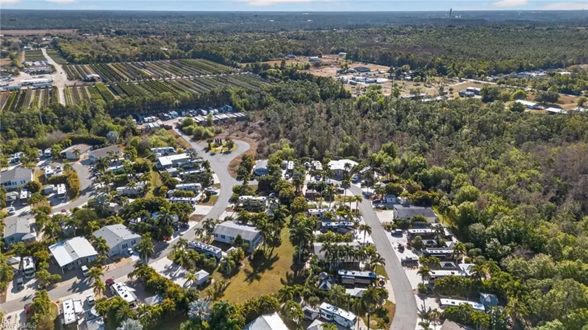 Aerial overview of property's location featuring nearby suburban area