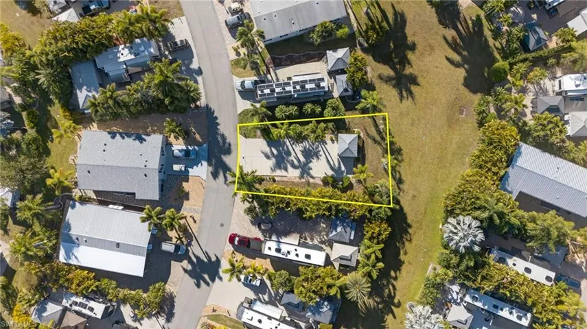 Aerial view of residential area featuring property boundaries highlighted