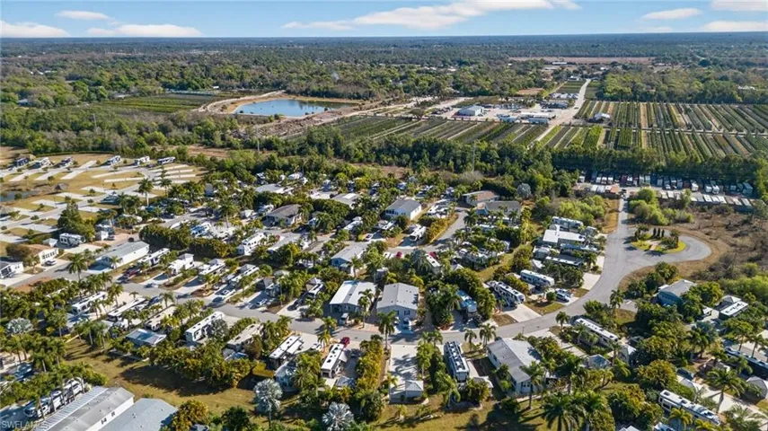 View of property location featuring nearby suburban area and a nearby body of water