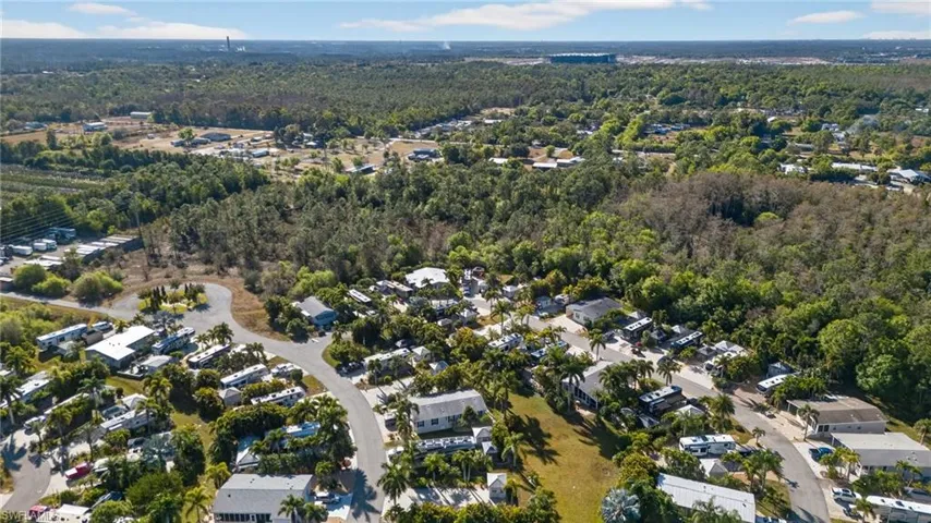 Aerial view of property's location featuring nearby suburban area