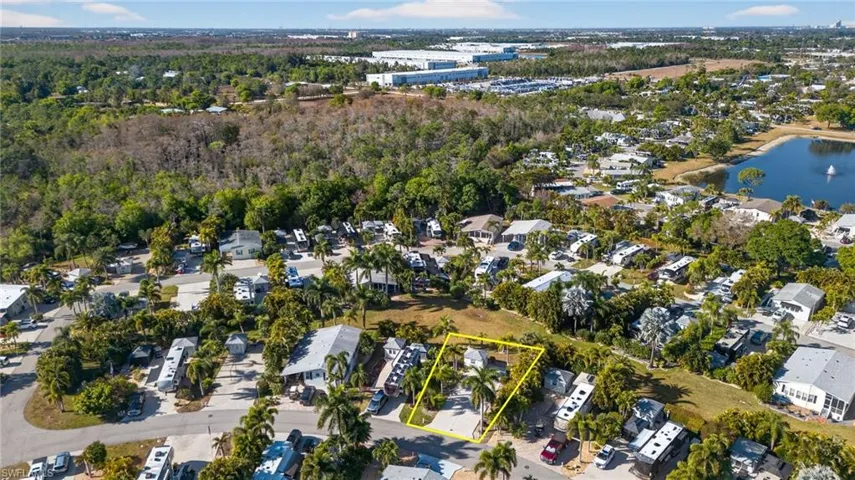 Aerial view of property's location featuring property boundaries highlighted and nearby suburban area