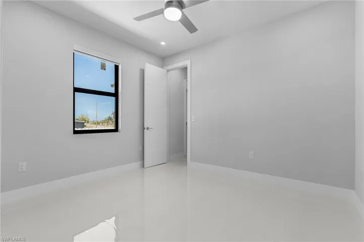 Unfurnished room featuring a ceiling fan