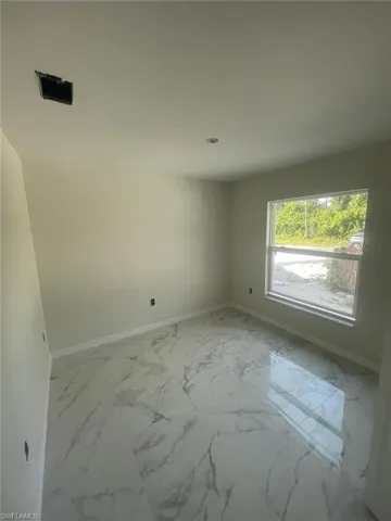 View of tiled spare room