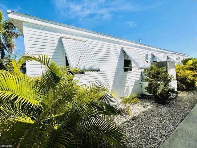 View of property exterior featuring a central AC unit