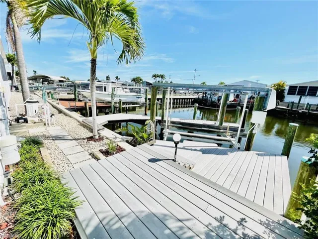 Dock with boat lift and a water view