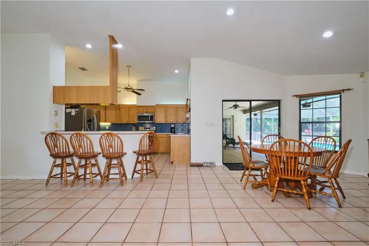 Dining Area near kitchen and den and breakfast bar.