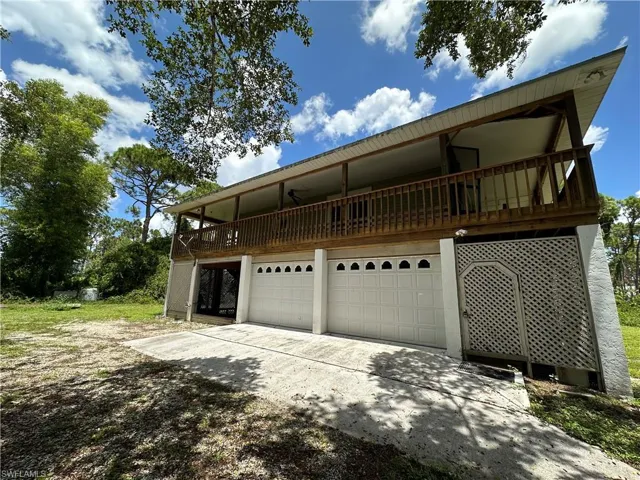 View of side of home featuring 2 garages